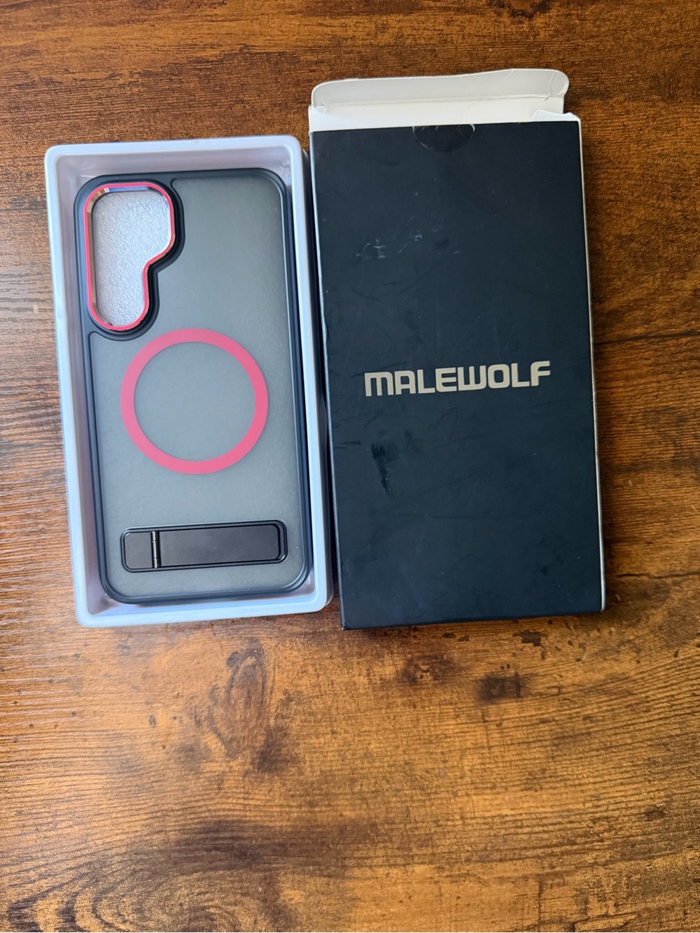 Black Phone Case with Pink Accent Ring and Kickstand